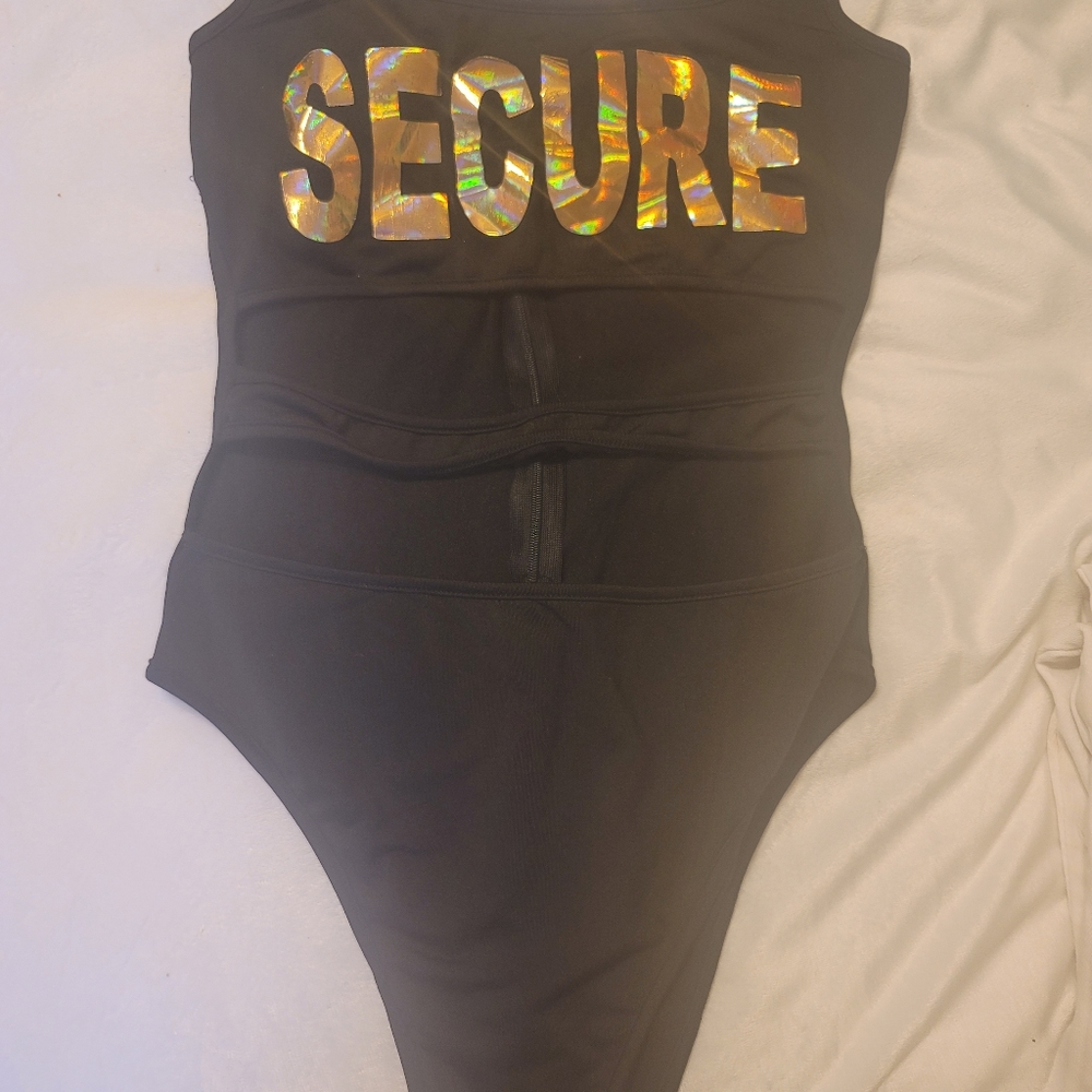 One piece bathing suit with cut out middle. Be Secure